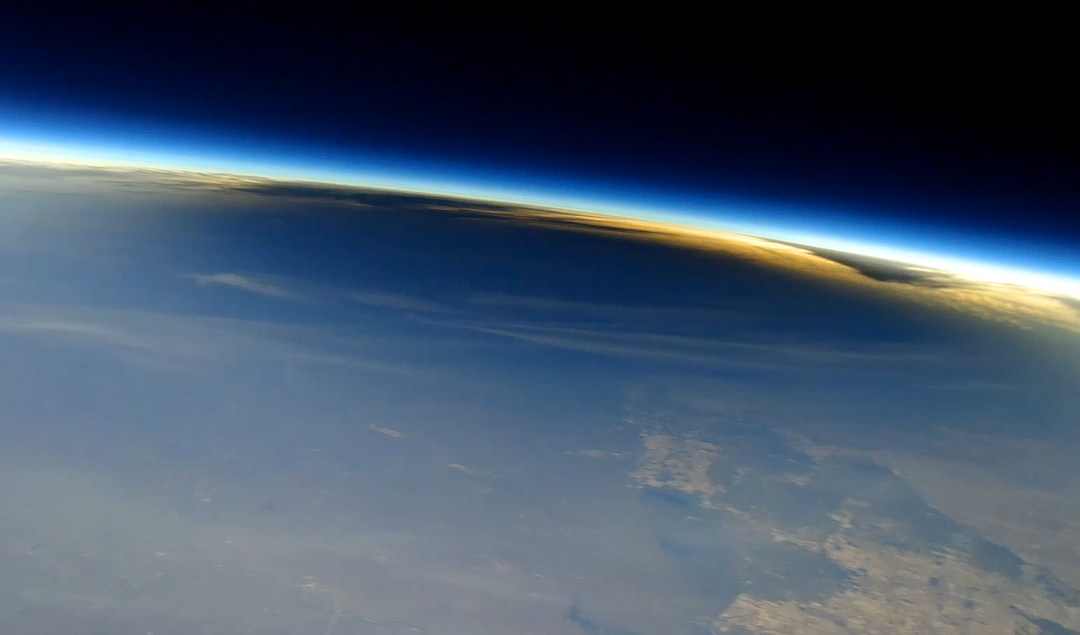 space-like view of Earth with the dark total solar eclipse shadow