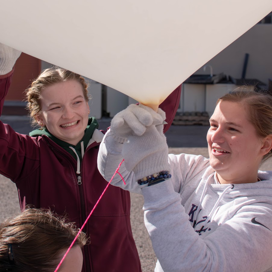 Two girls with a balloon