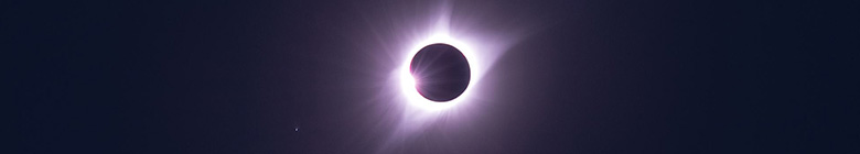 Sunlight streaming out from behind the moon. An eclipse.
