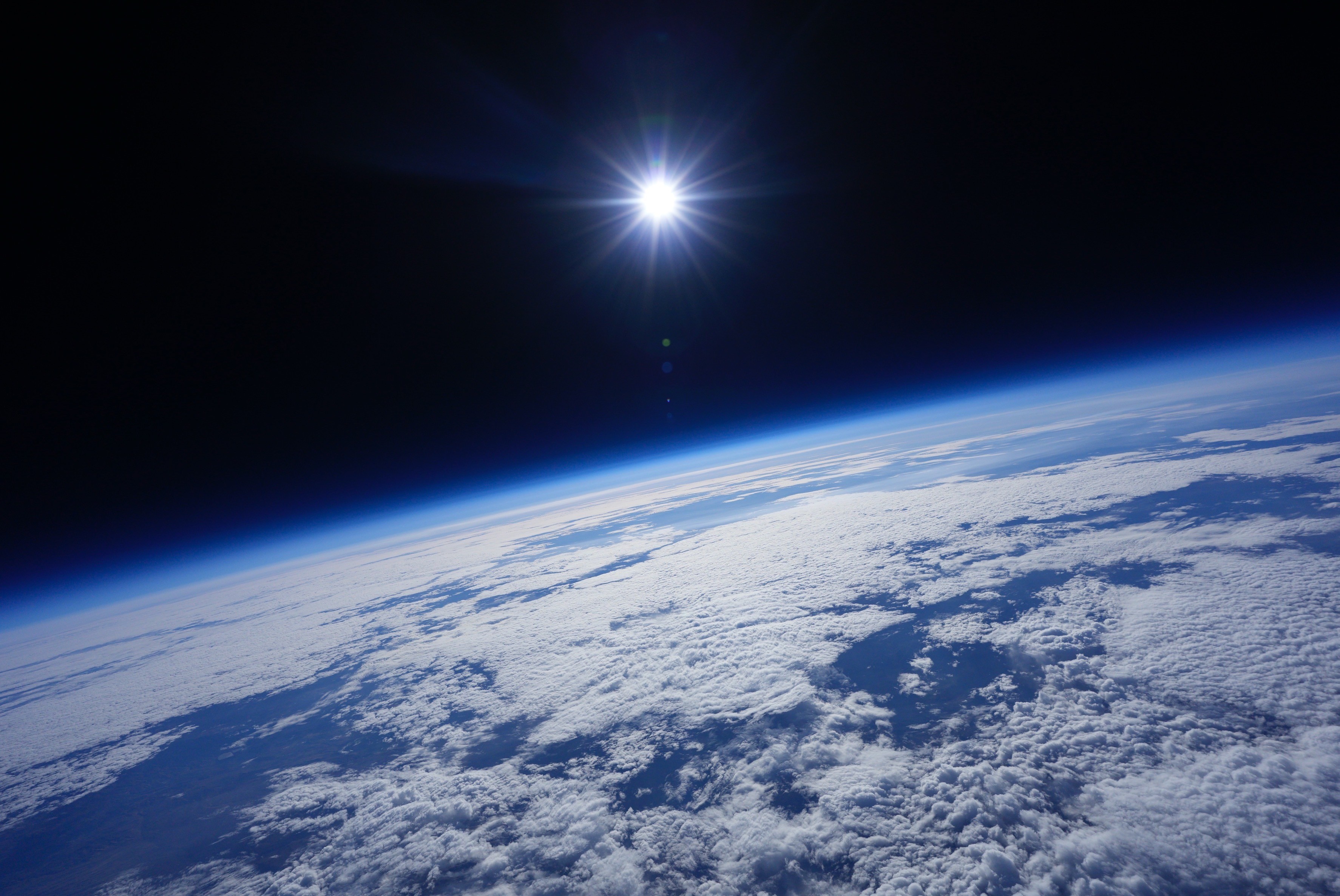The curve of the Earth with the sun shining