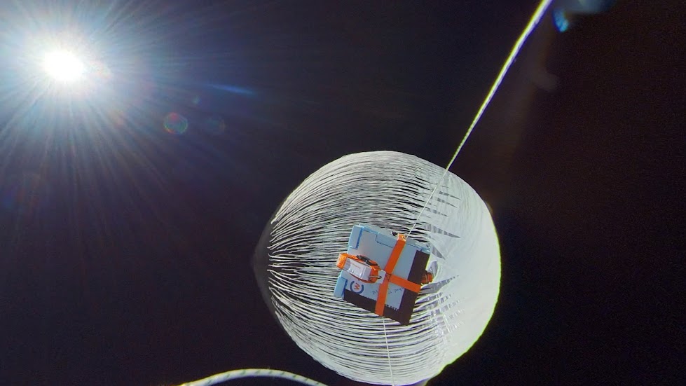 A balloon popping in space