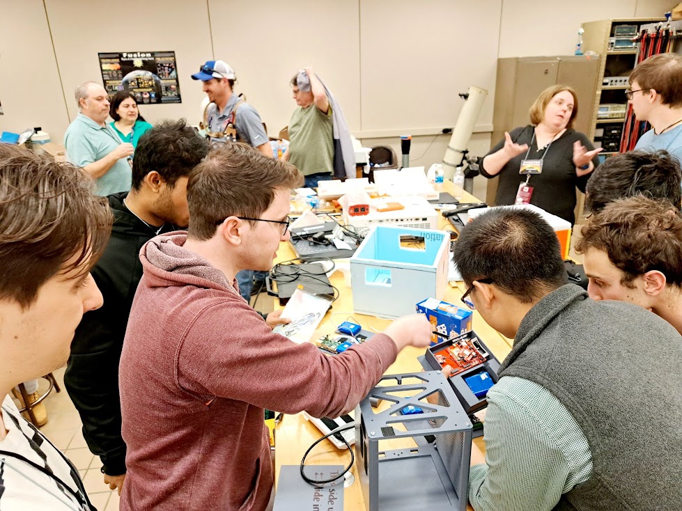 A team assembling payloads