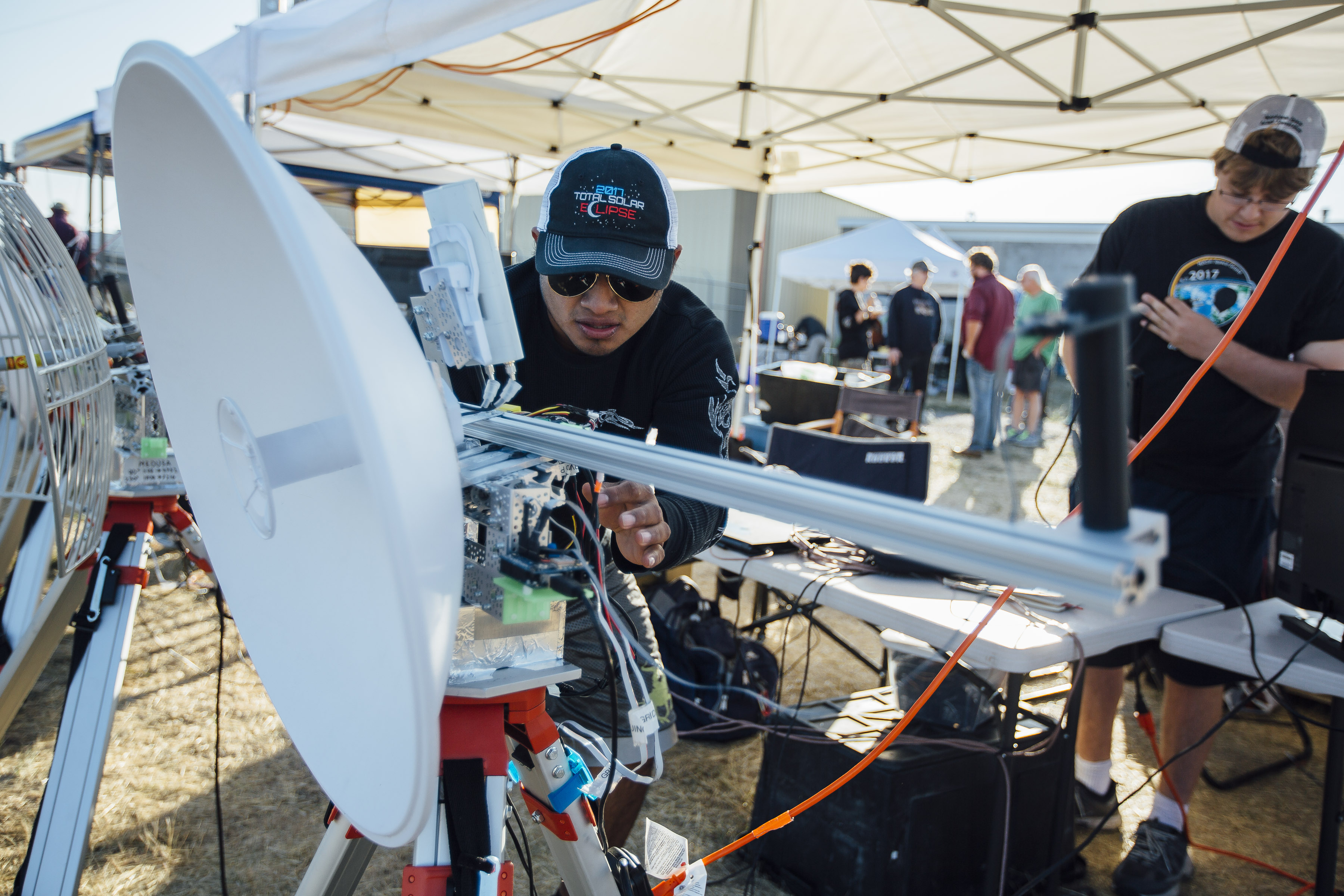 The ground station preparing a satelite dish for the launch