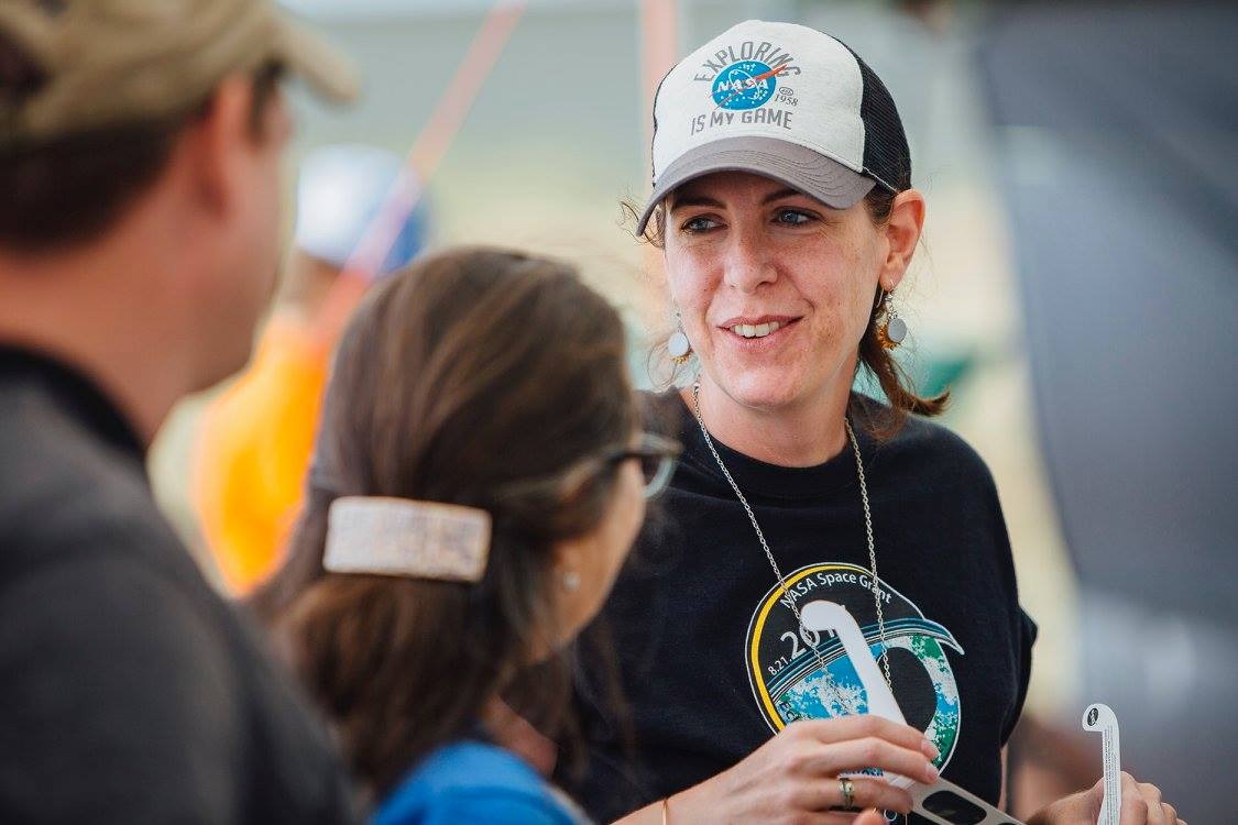 Angela speaking with 2 people for the launch preparations