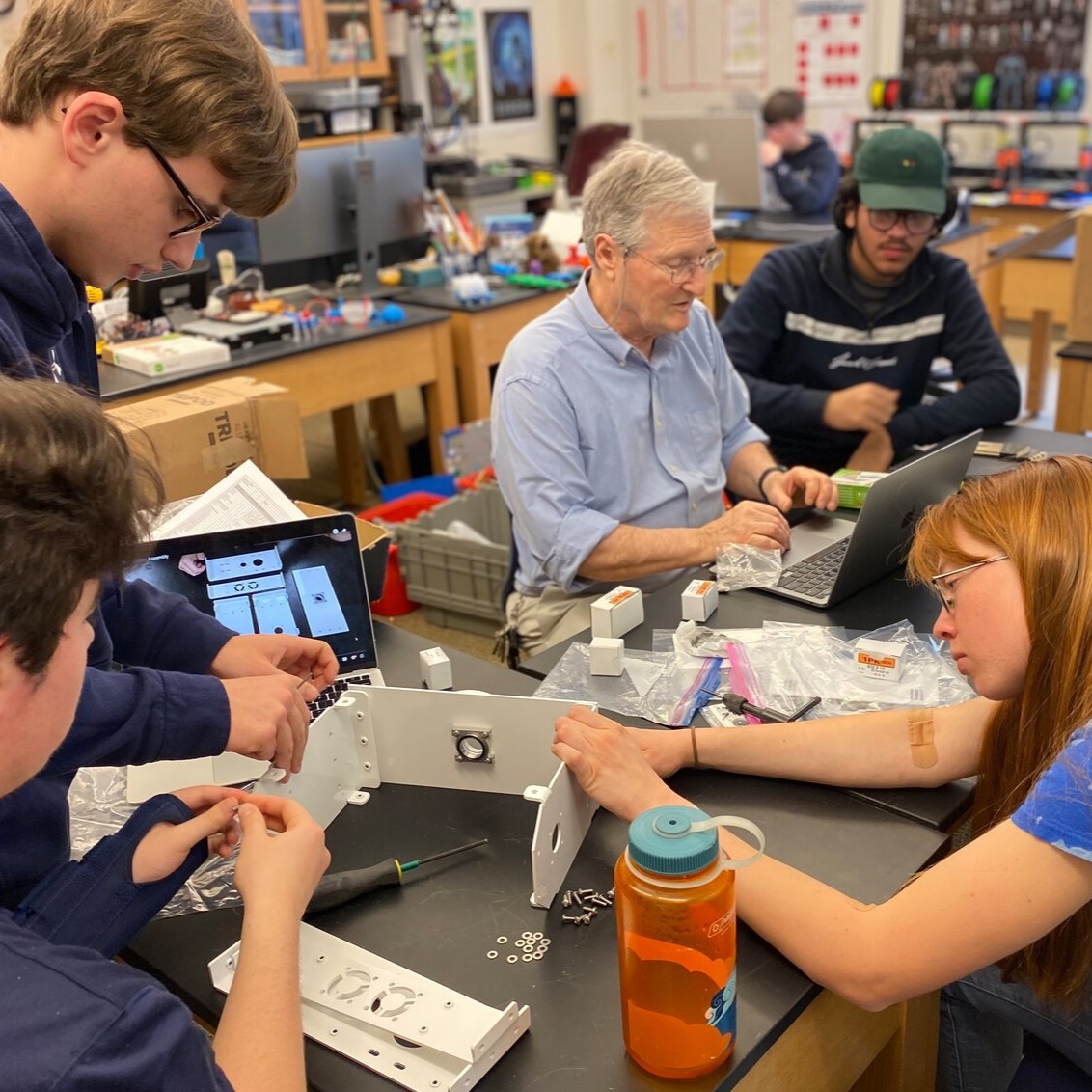 A groupd of people working at a table