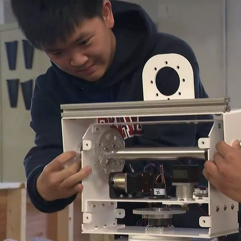 A student preparing equipment